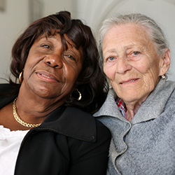 two elderly woman smiling